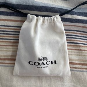 Coach earring and necklace rose gold set.